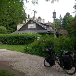 Old mansion with Ralph standing outside.